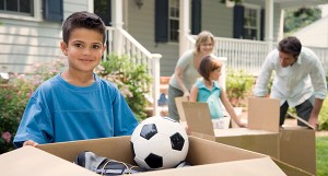Relocation: Boy holding a moving box